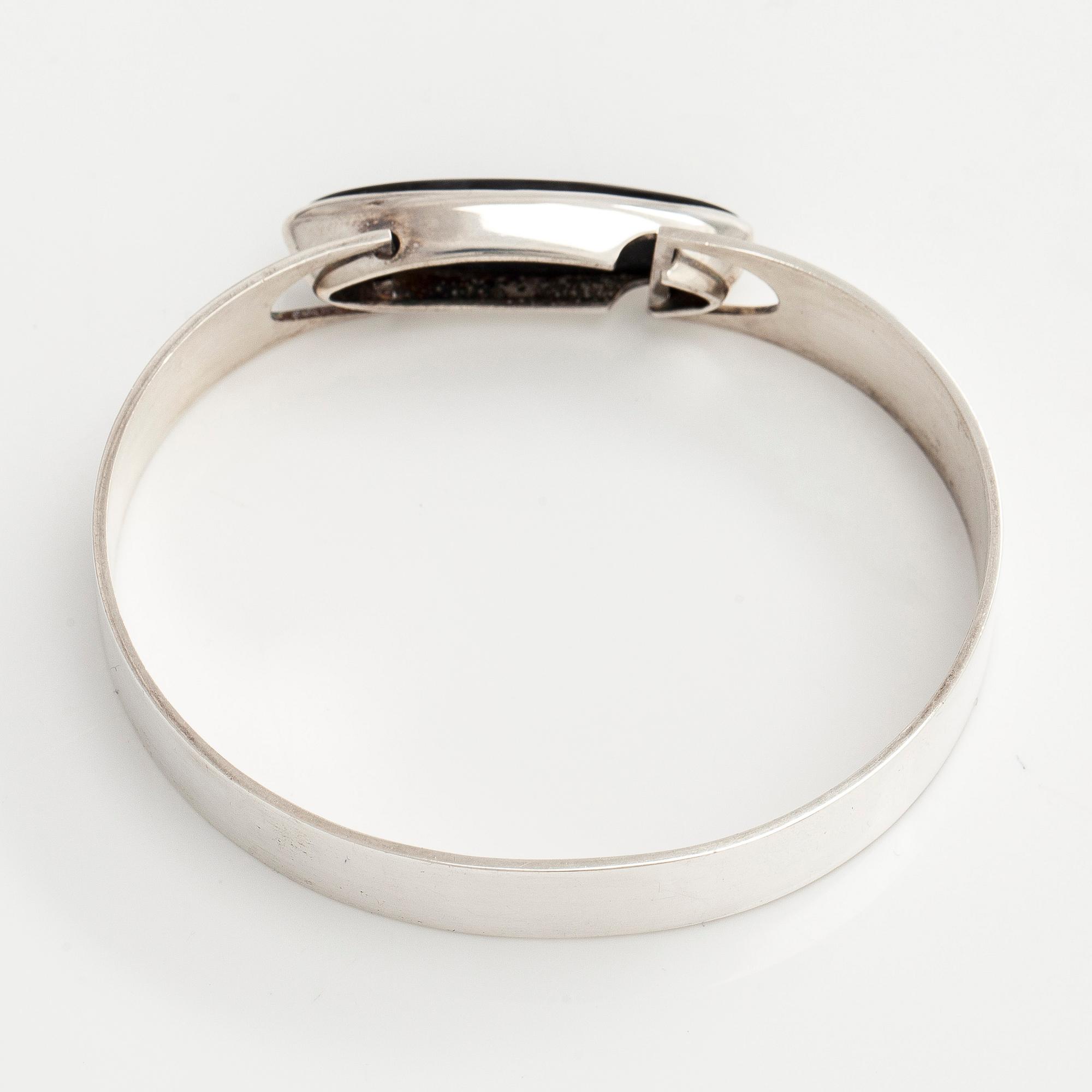 Rannekoru, pyöröhiottu spektroliitti, hopea, Kaunis Koru, 1960-luku.