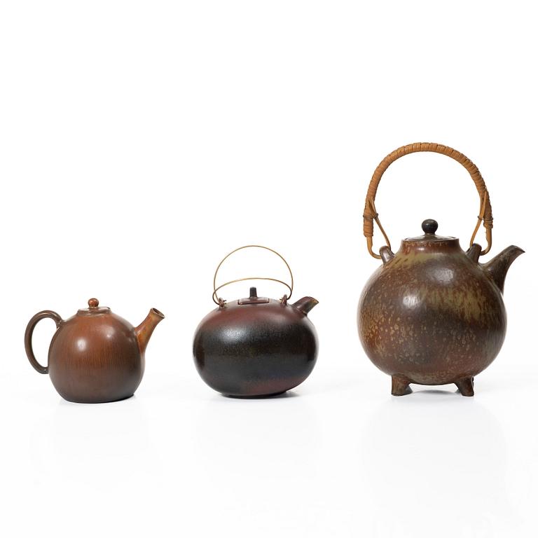 Gösta Grähs, , Gunnar Nylund and Carl-Harry Stålhane, three stoneware teapots, Rörstrand.