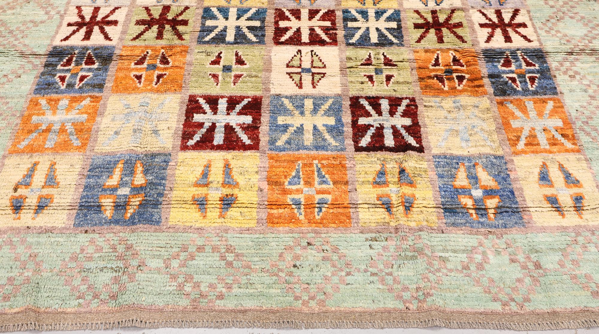 A Moroccan design carpet, c. 299 x 198 cm.