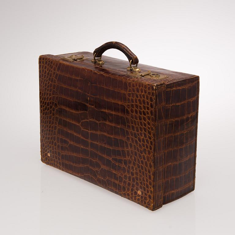 A TRAVEL TOILET CASE, leather, German 1910-20s, boxes with silver lid.