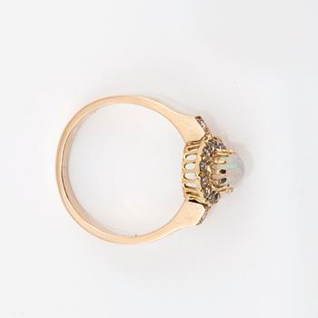 An opal and old-cut diamond ring.