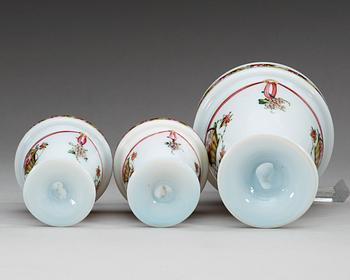 A set of three opaline glass vases, 19th Century, presumably Russian.