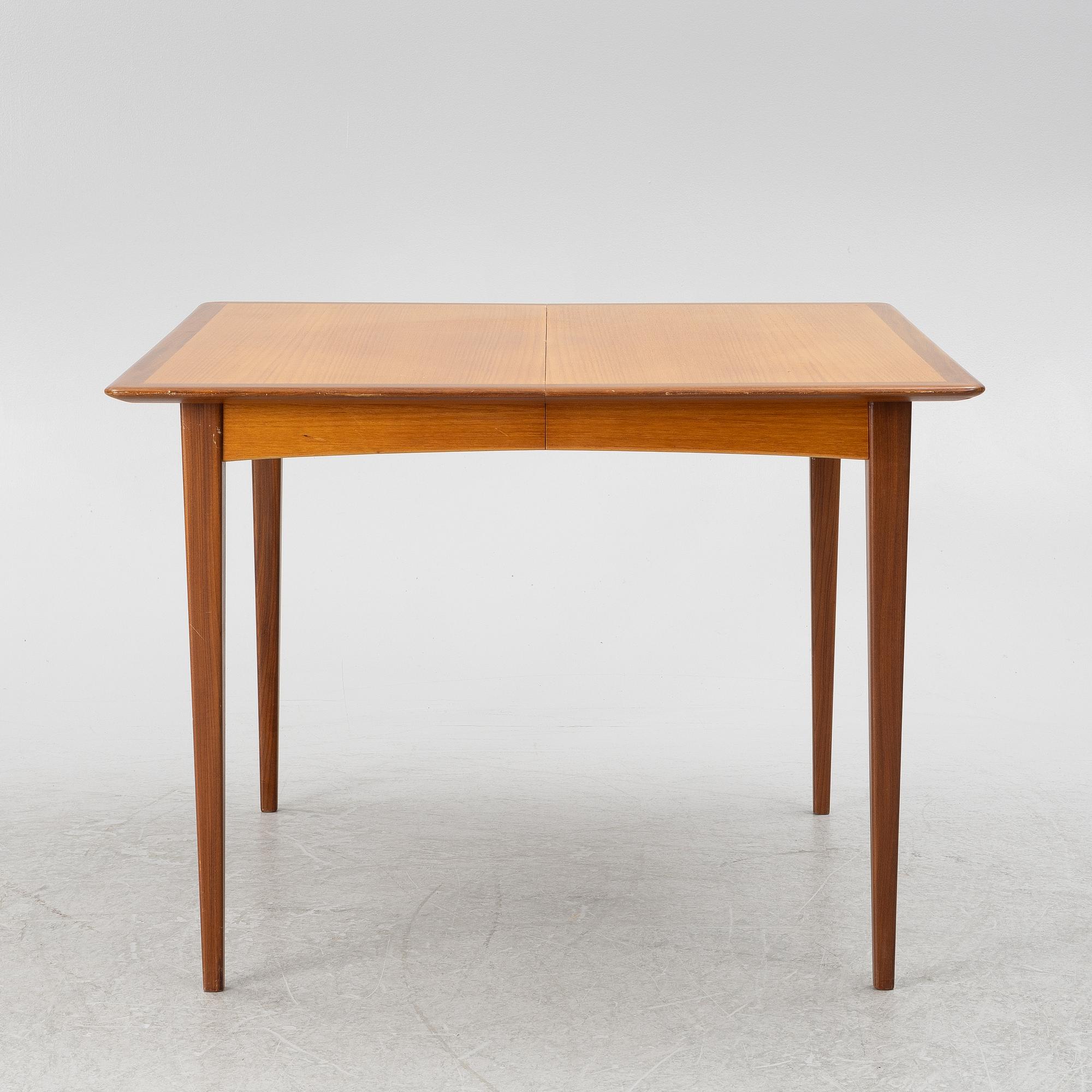 A dining table and four chairs, 1950s-60s.