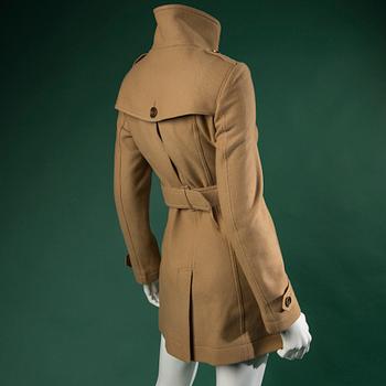 A TRENCHCOAT by BURBERRY.