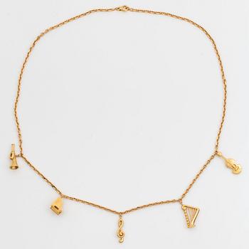 An 18K gold  Dior necklace with charms.