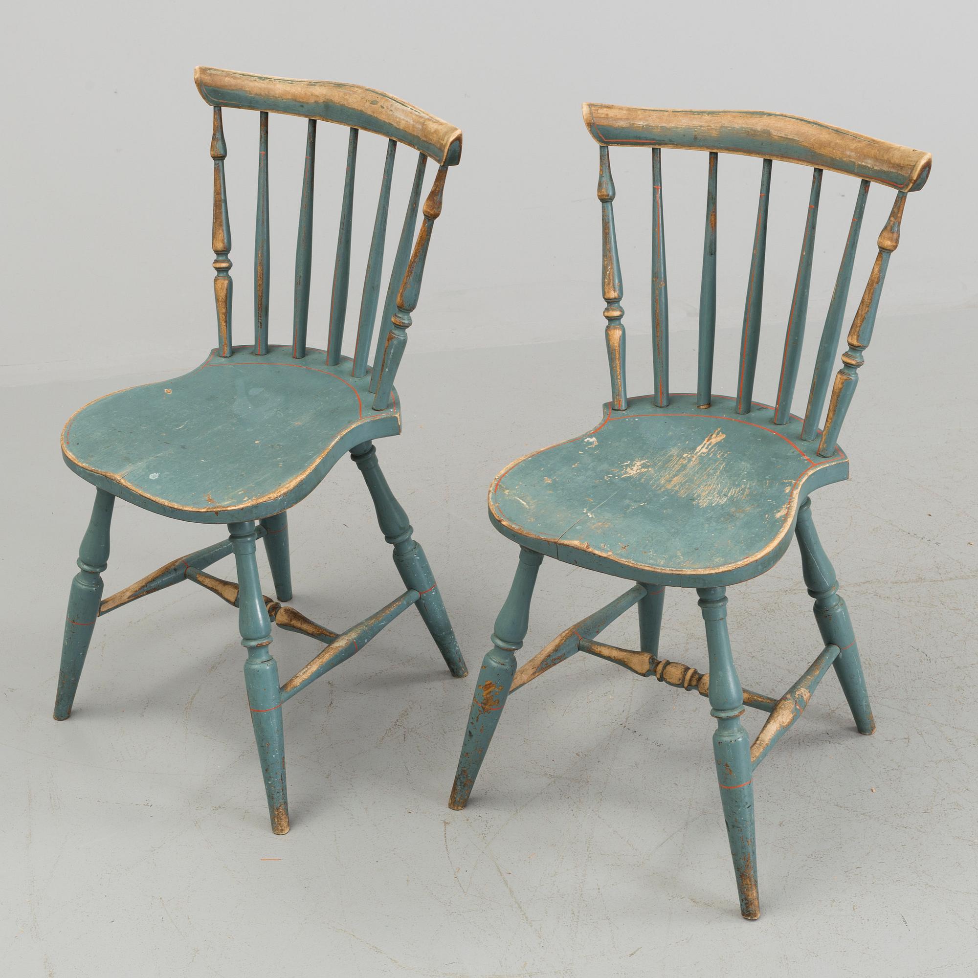 A pair of late 19th century painted chairs.