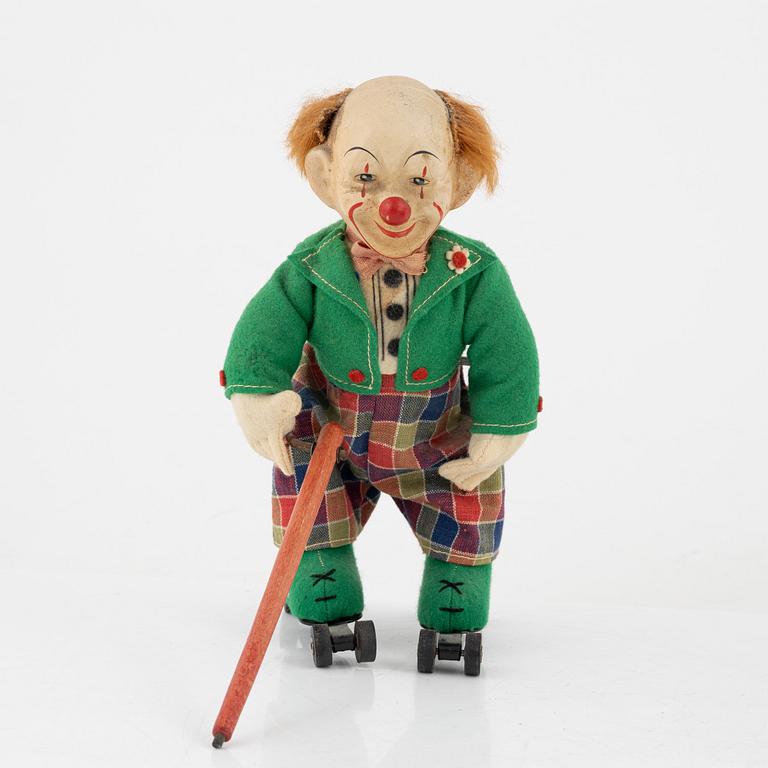 A set of five toys, including 'Rolly' clown from Schuco, 20th century.
