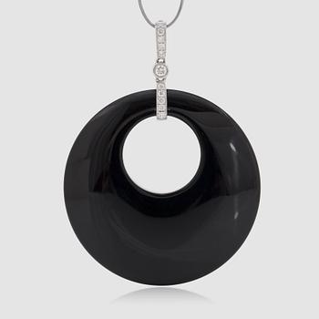 1237. An onyx and brilliant-cut diamond pendant.