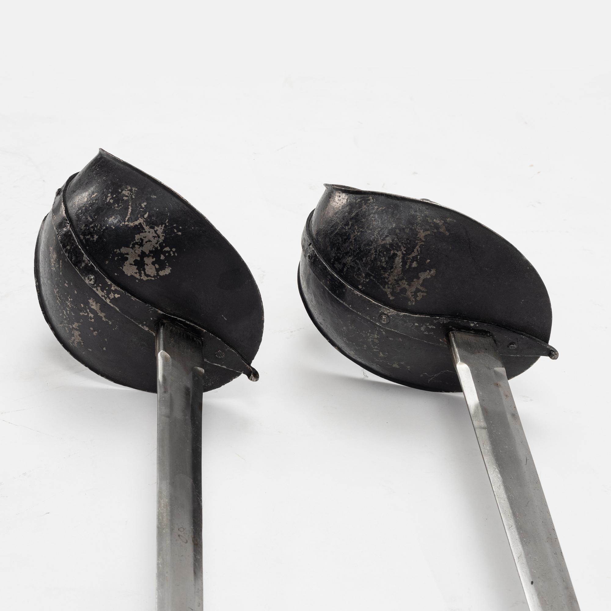 A Swedish pair of military practice swords 1886 pattern.