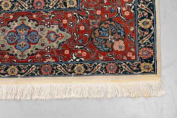 A carpet, semi-antique Tabriz, ca 379 x 280 cm.