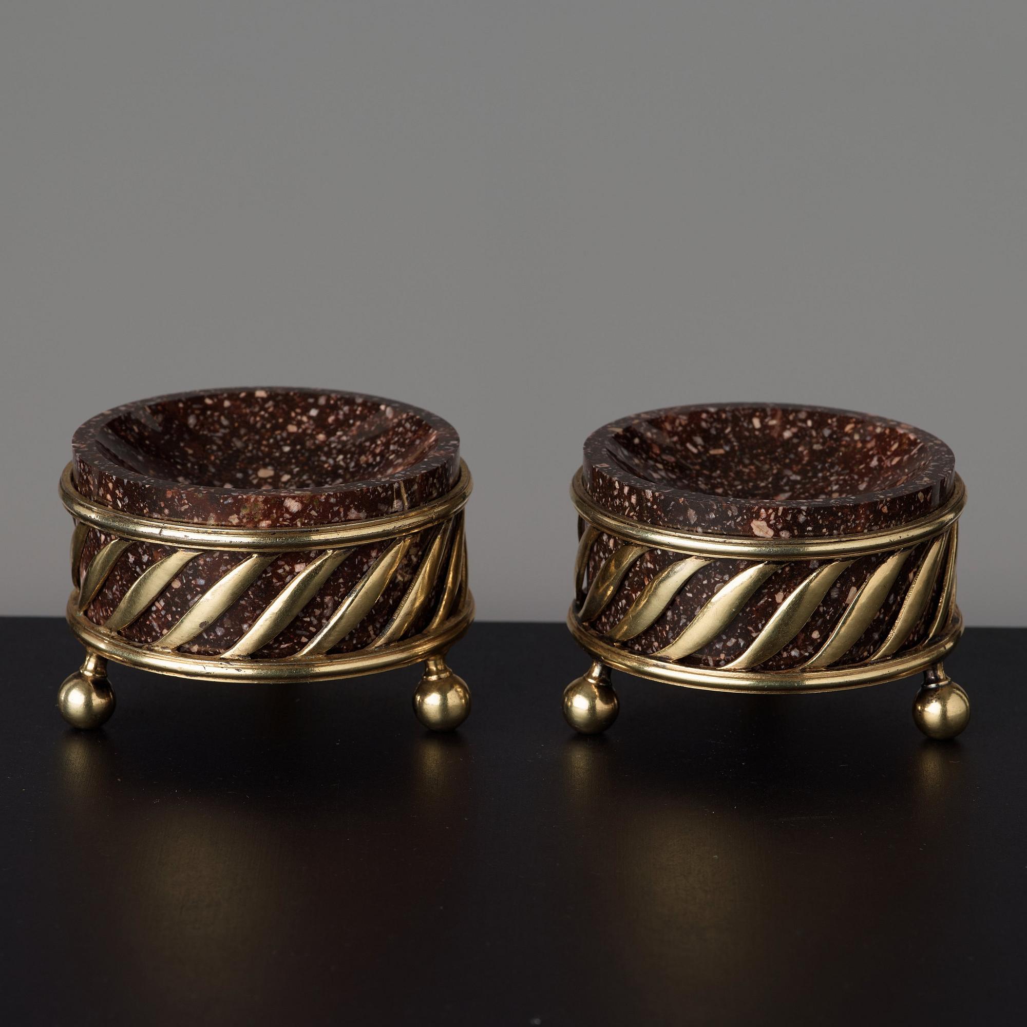 A pair of gilt silver and porphyry salts, by Gustaf Folcker, Stockholm 1827.