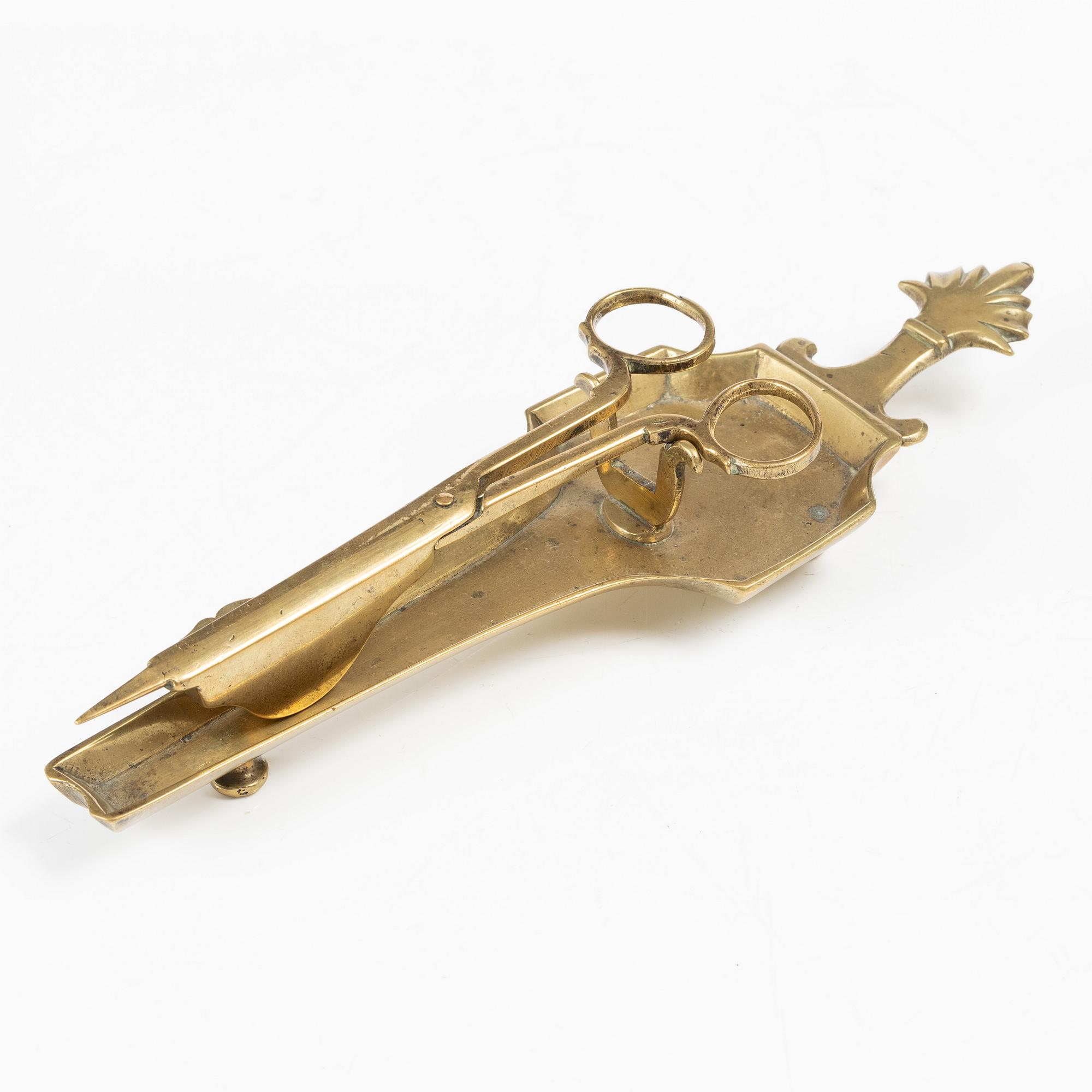 A Swedish/North European baroque brass wick snuffer and tray, circa 1700.