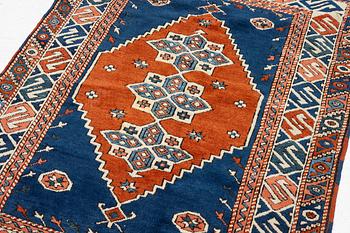 A semi-antique Turkish rug, 175 x 123 cm.