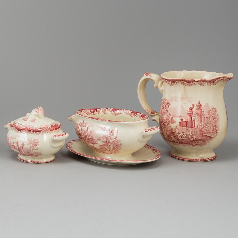 A part red 'Bengali' creamware dinner service, Rörstrand, 1948-56 (111 pieces).