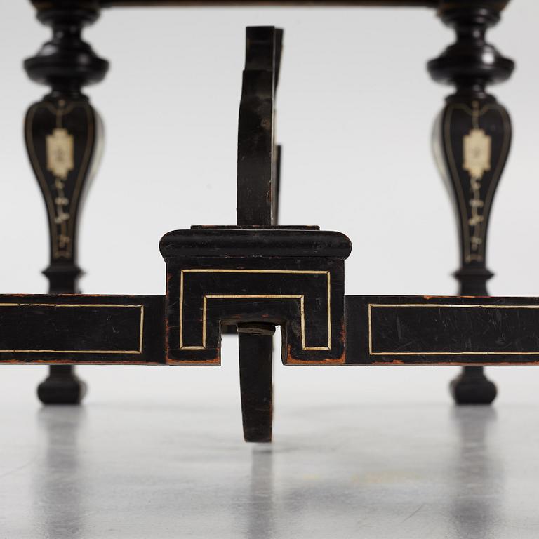 A Renaissance-style ebony, ebonized and ivory-inlaid library table, late 19th century, presumably Germany.