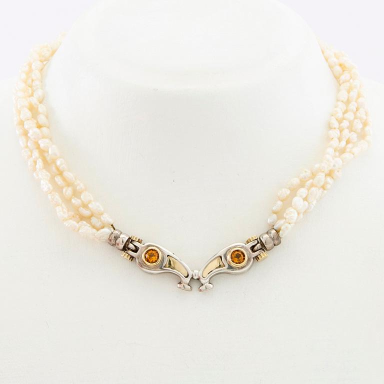 Tonino Lamborghini, Necklace of cultured pearls with a pendant of 18K gold, silver, and faceted citrines.