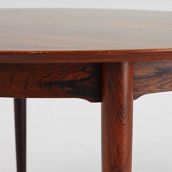 Niles Otto Møller, a rosewood veneered table with four chairs, JL Møller, Denmark, 1950's/60's.
