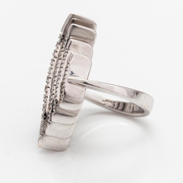 A pair of 18K white gold earrings and a ring with diamonds ca. 0.90 ct in total. Moscow.