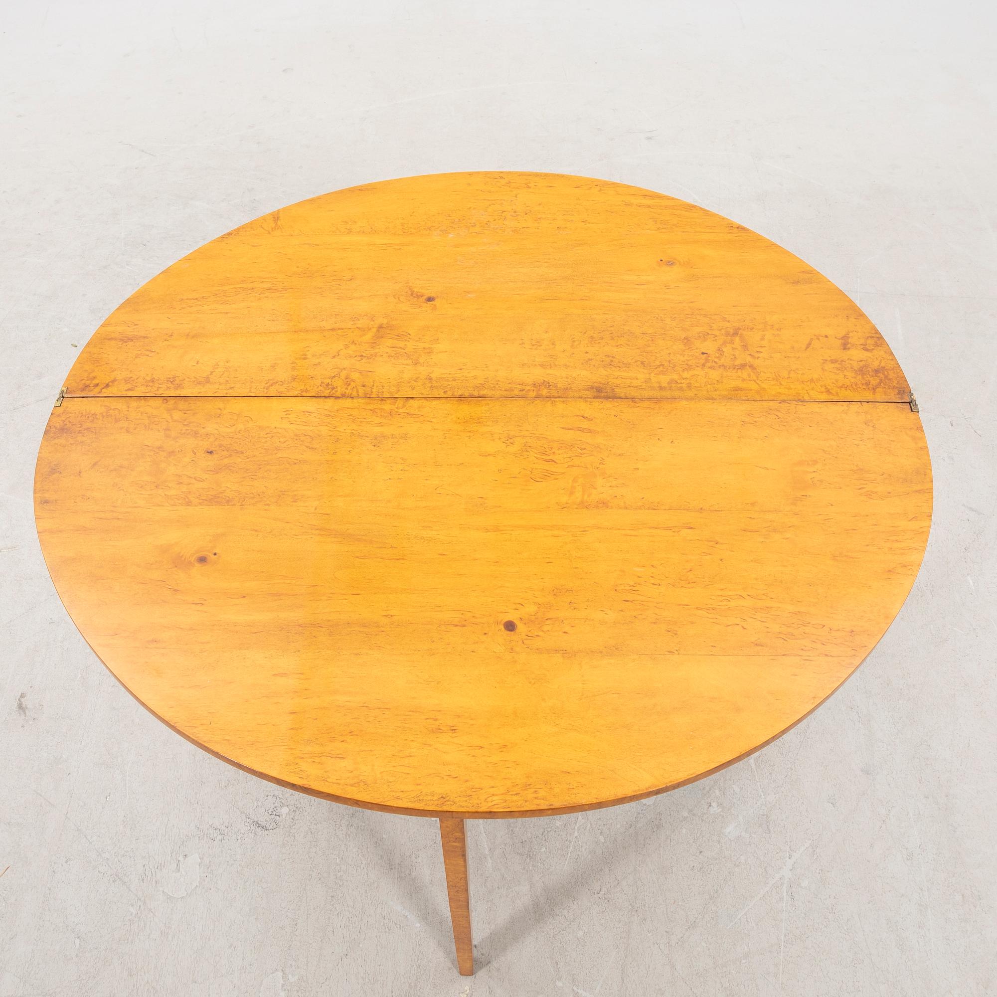 A birch folding table later part of the 19th century.