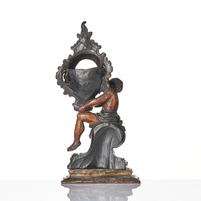 A Northern-European rococo carved pocket-watch holder, later part 18th century.