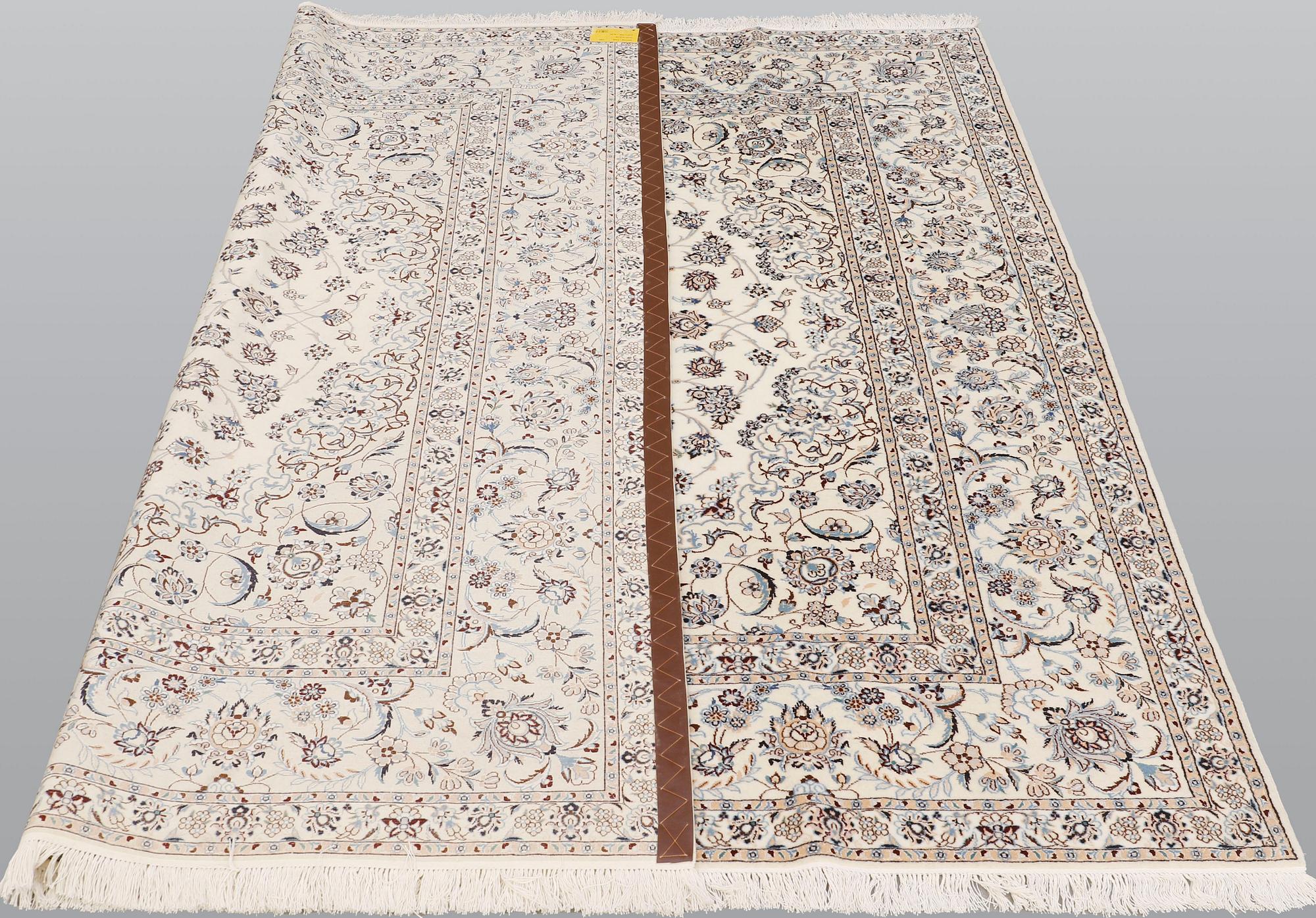 A Nain part silk carpet, 210 x 200 cm.