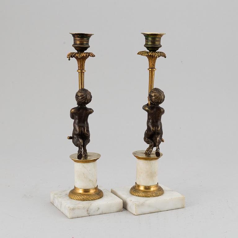 A pair of gustavian style candles sticks, circa 1900.