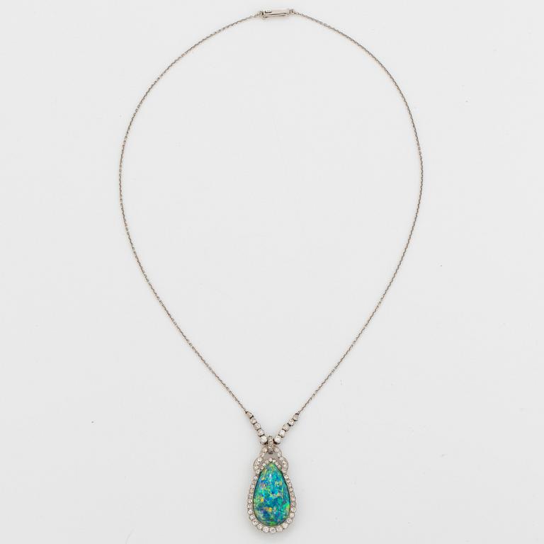 A platinum and black opal necklace set with old- and eight-cut diamonds.