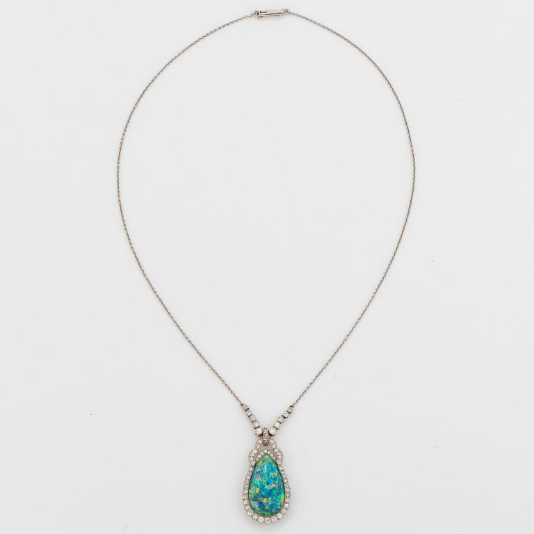 A platinum and black opal necklace set with old- and eight-cut diamonds.