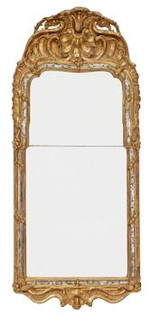 910. A Swedish Rococo mirror.