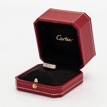 Cartier, an 18K white gold 'Love' ring with three brilliant-cut diamonds.