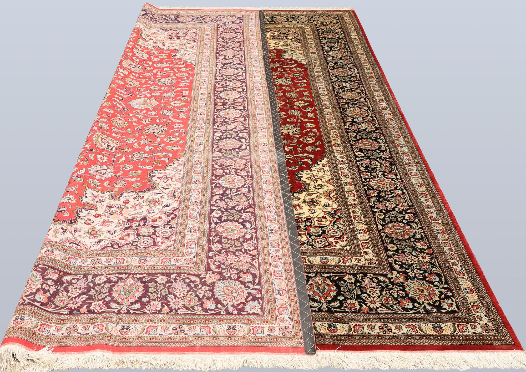 A silk Ghom carpet, c. 346 x 247 cm.