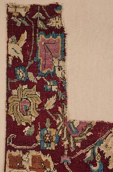 A MUGHAL CARPET/"INDO PERSIAN" FRAGMENT, ca 175 x 60,5 cm, probably 17th century. Framed.