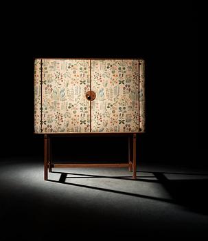 A Josef Frank mahogany cabinet, doors and sides covered in Frank's floral chintz fabric 'Fatima', Svenskt Tenn ca 1937.