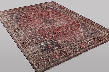 An oriental, vintage design carpet, c. 404 x 301 cm.