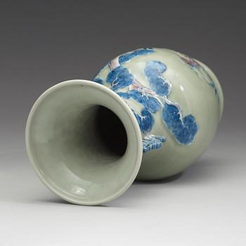 A celadon ground porcelain baluster vase, Qing dynasty (1644-1912).