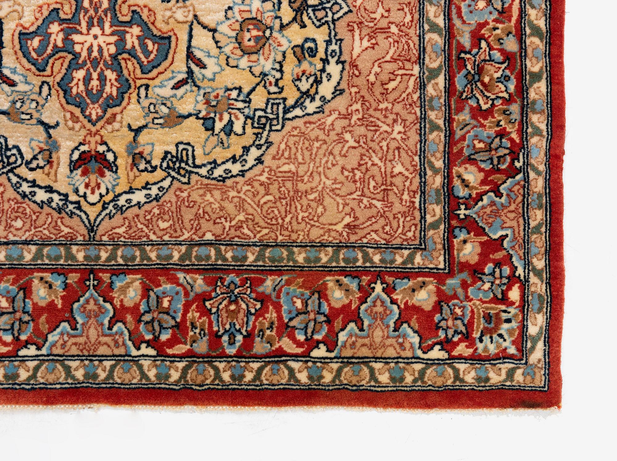A semi-antique Isfahan rug, central Iran, part silk, signed (Mohammed) Seirafian, c. 120 x 70 cm.