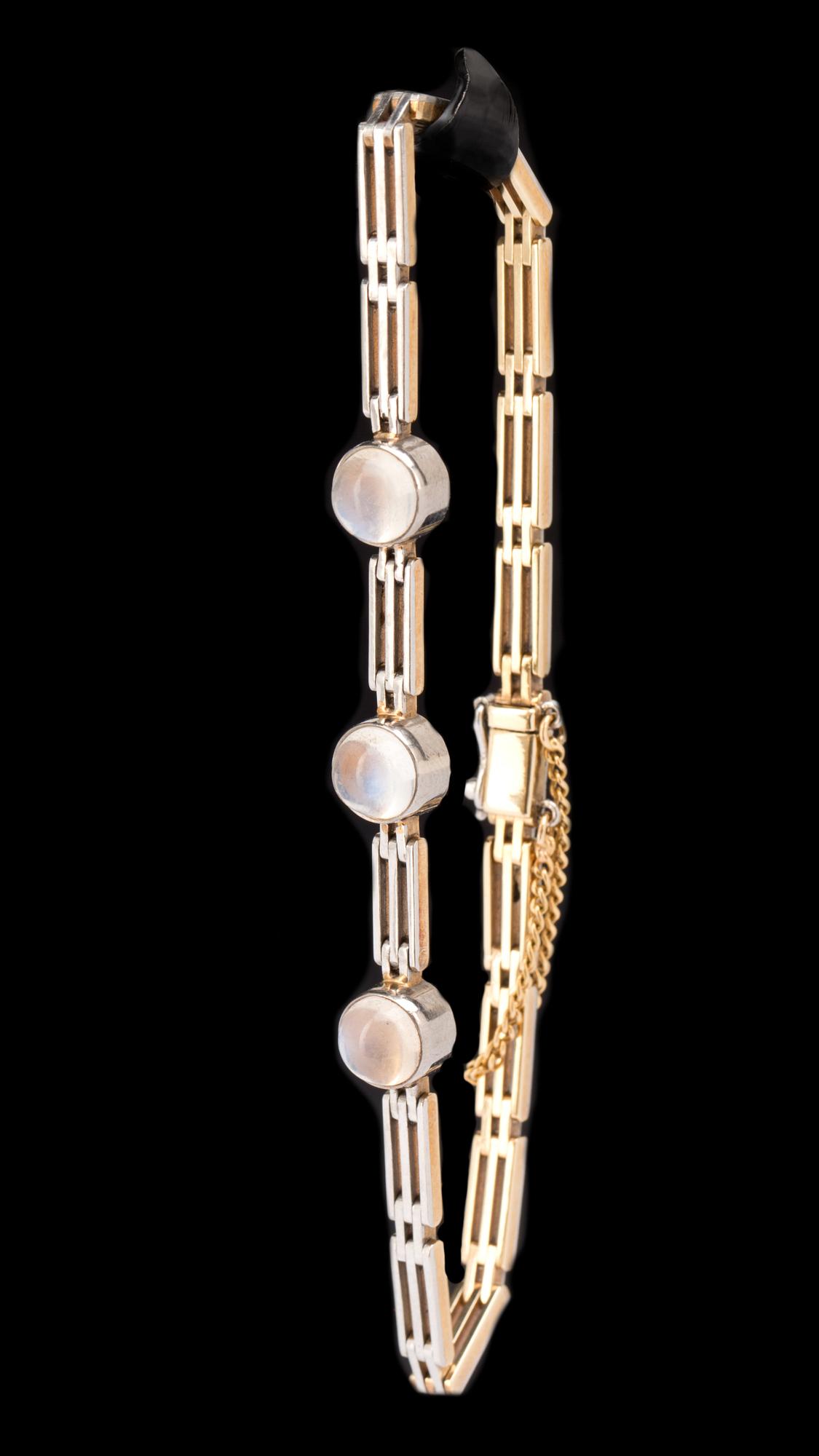 ARMLÄNK med RING, 18k guld/vitguld med månstenar. Vikt ca 9,5g.