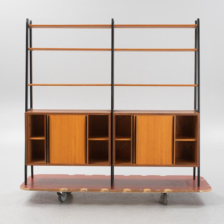Teak veneered book cases with cabinets.
