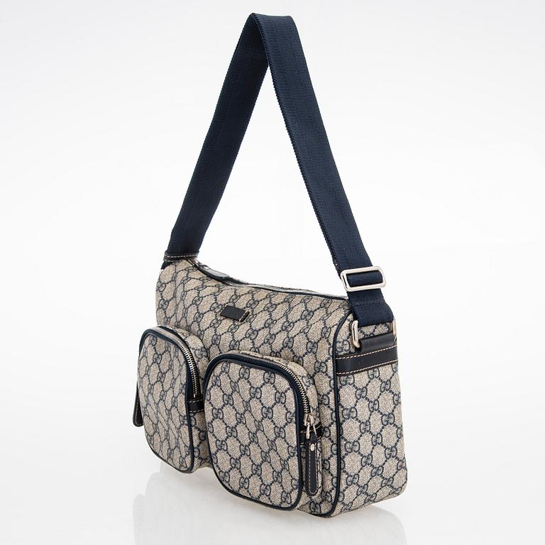 Gucci, A "GG Supreme messenger" bag.