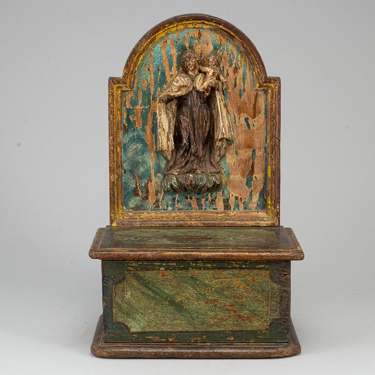 A painted wood alms box, probably 17th century.