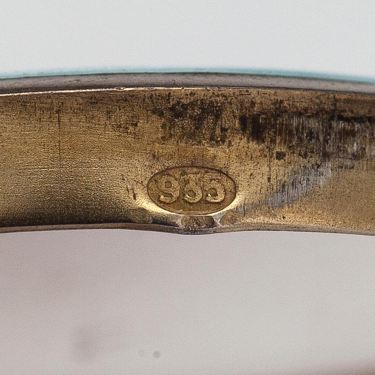 Halsband, medaljong med spegel, silver och emalj. Importstämplad I Erling, Helsingfors tidigt 1900-tal.