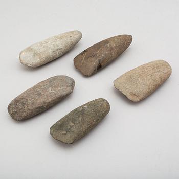 Five neolithic stone axes.