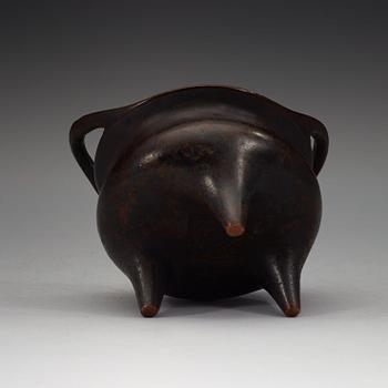 A copper alloy tripod censer, Ming dynasty, 17th Century with Xuandes four character mark.