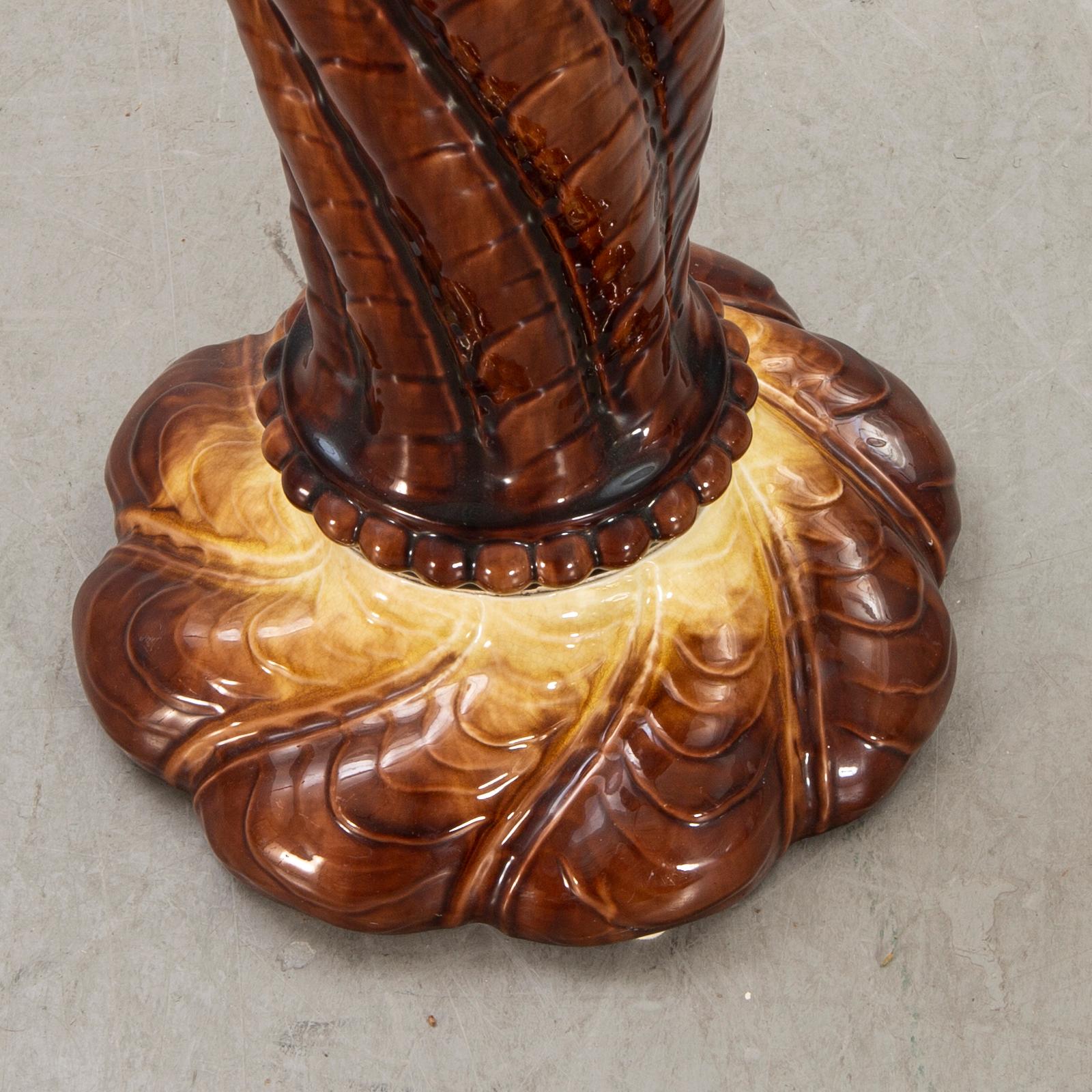 AN early 1900s majolica pedestal and flower urn.