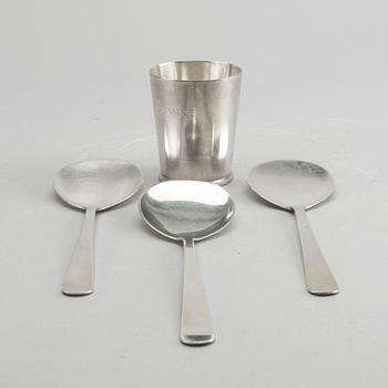 A Swedish 20th century sterling set of three sandwich spoons ad a beaker mark of W Nilsson Lund 1965, 1967 and 1946,