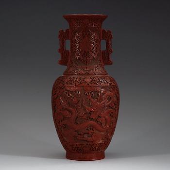 A lacquer vase, late Qing Dynasty (1644-1912) with Qianlong mark.