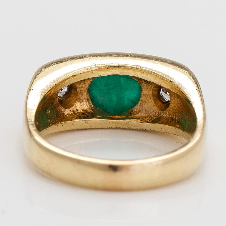 An 18K gold ring, with a cabochon-cut emerald and diamonds totalling approximately 0.18 ct.