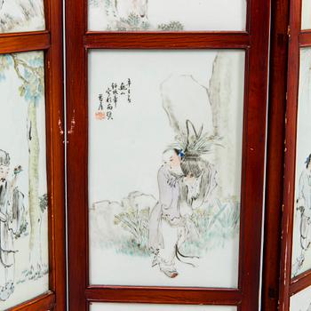 A Chinese folding screen with 48 porcelain tiles, late Qing dynasty, signed Ren Huanzhang, and dated 1881.