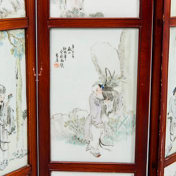 A Chinese folding screen with 48 porcelain tiles, late Qing dynasty, signed Ren Huanzhang, and dated 1881.