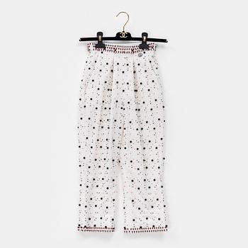 Chanel, a pair of broderie anglais trousers with pearls, size 34.